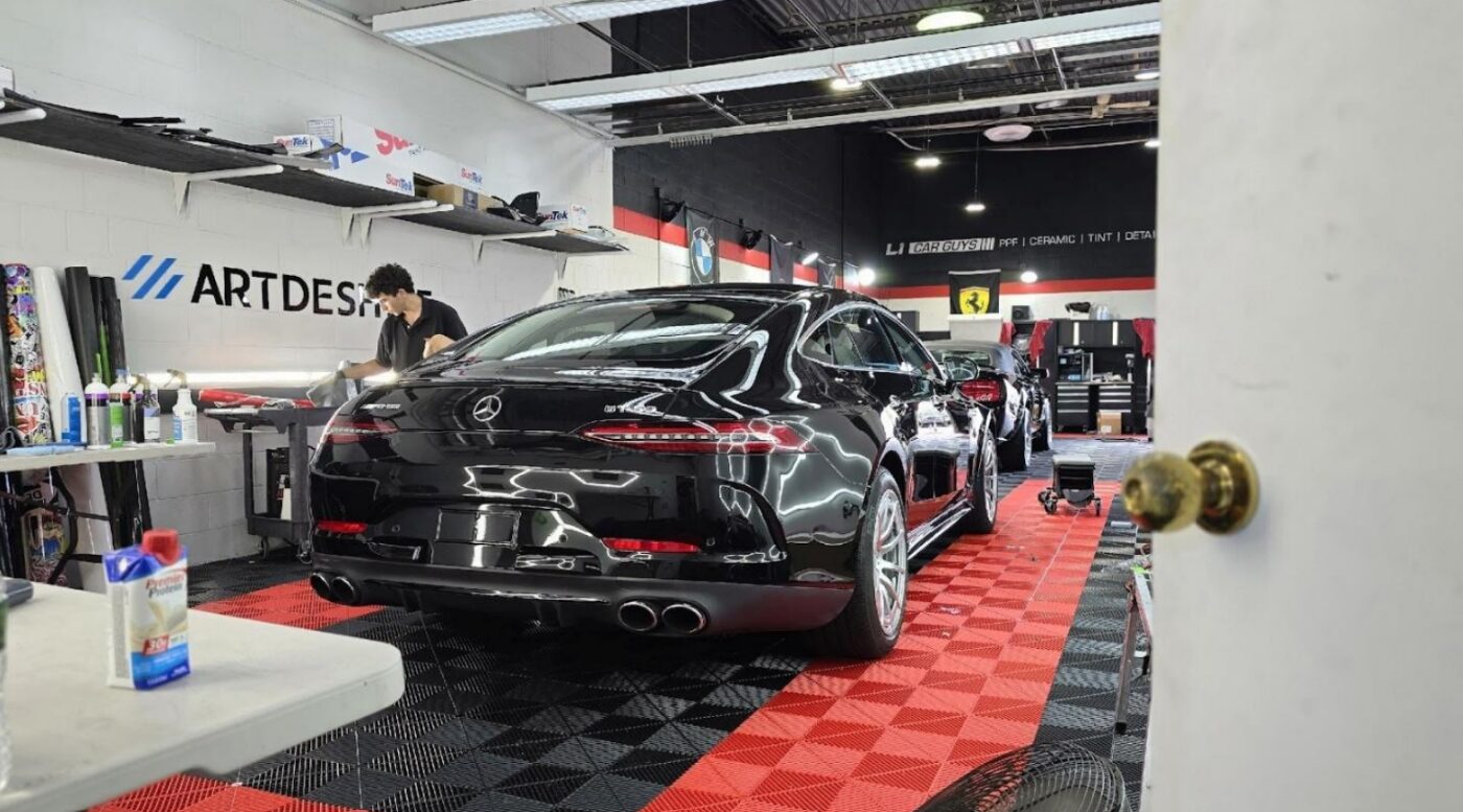 Glossy black Mercedes-AMG GT 53 rear profile at a car detailing studio | Li Car Guys