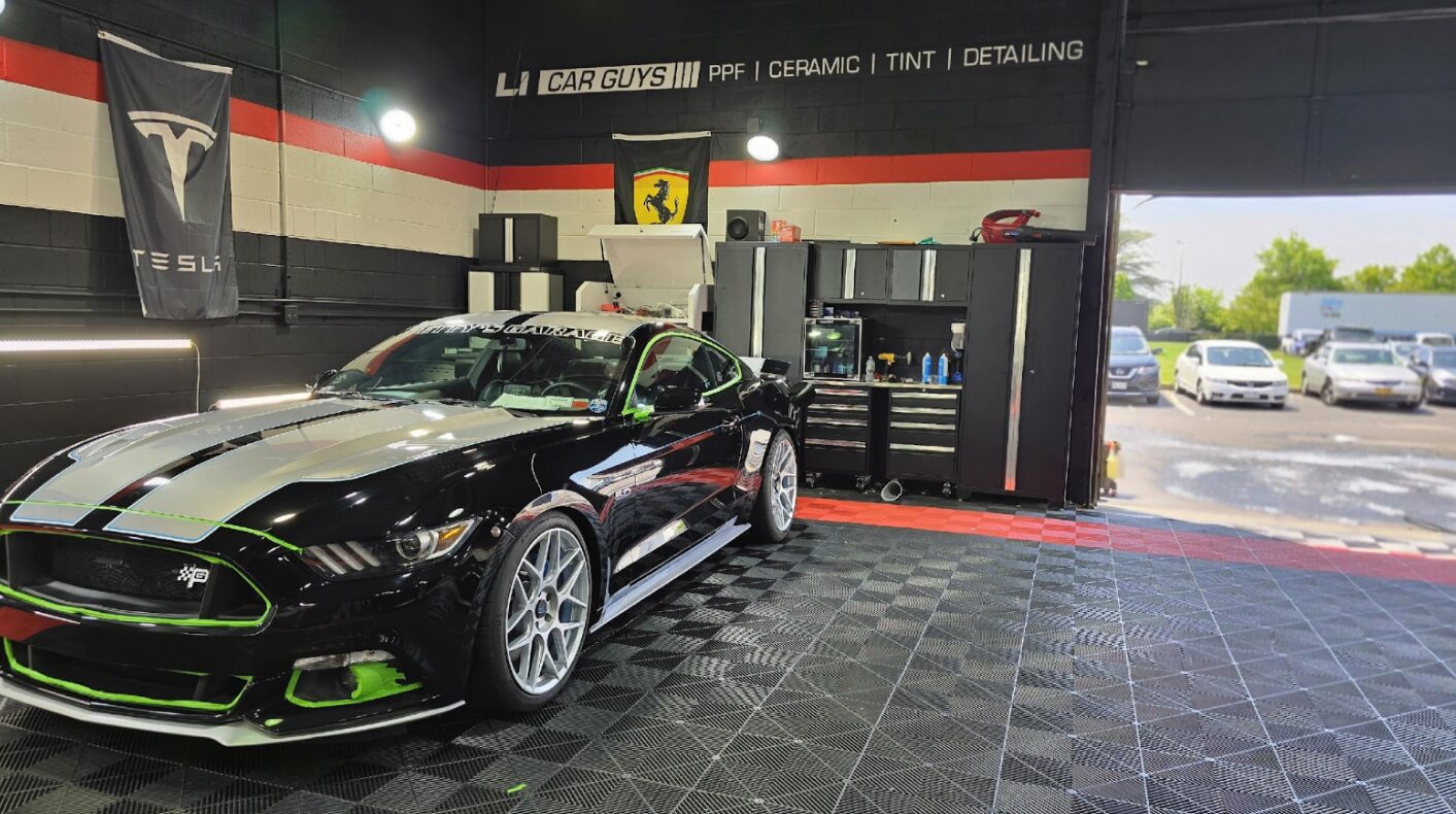 Custom black Ford Mustang GT inside a detailing shop | ppf servicesin Long Island | Li Car Guys
