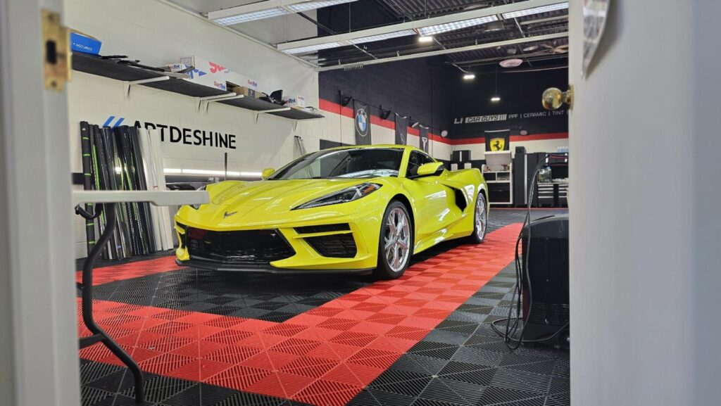 Bright yellow Corvette C8 inside detailing shop | window tinting in Long Island | Li Car Guys